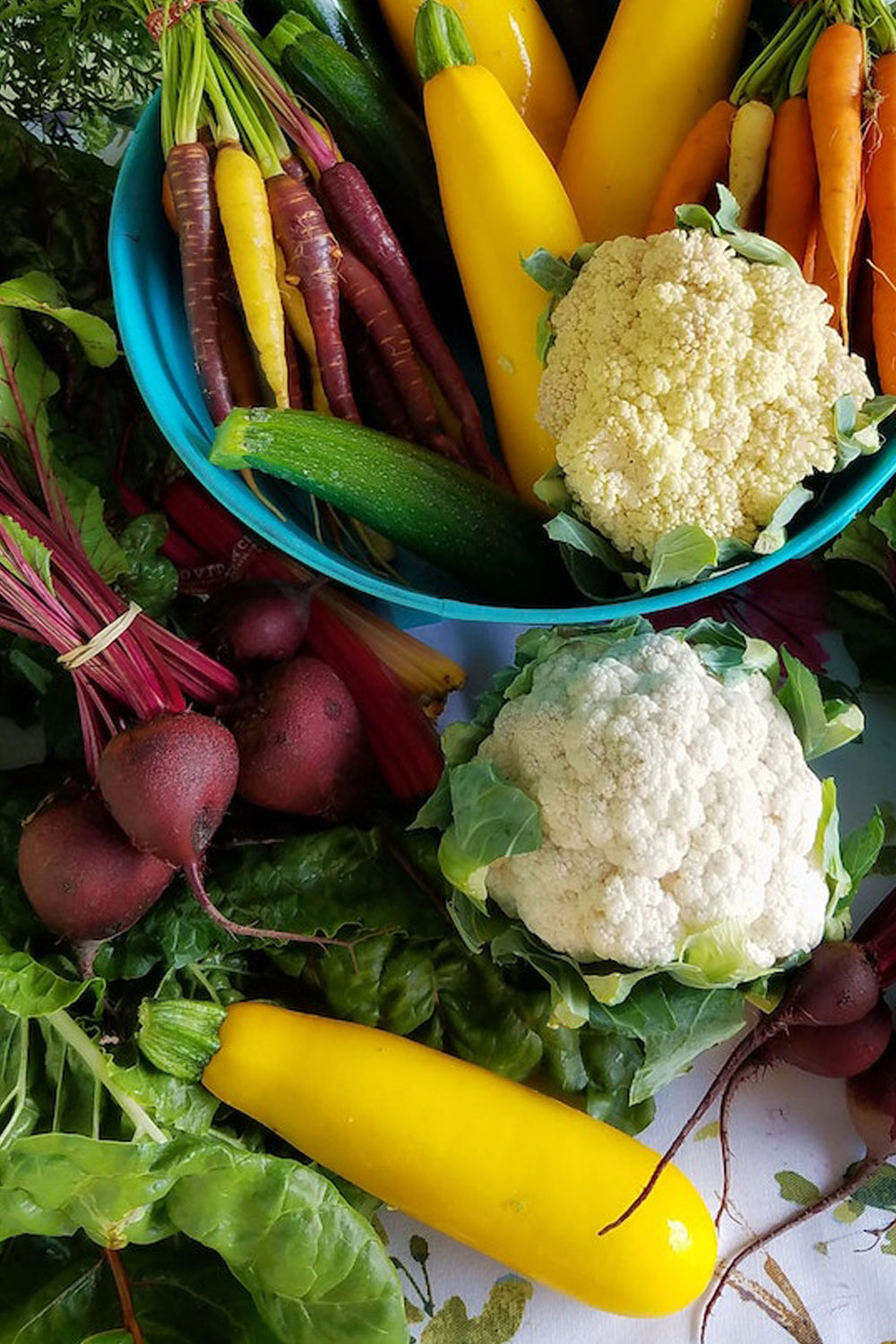 fresh vegetables - cauliflower, beets, zucchini, and greens