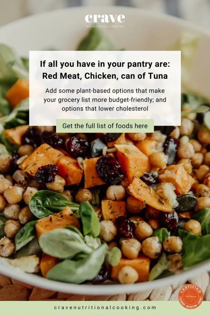 round white bowl with roasted butternut cube, currants, basil leaves, roasted chickpeas, in a healthier salad meal