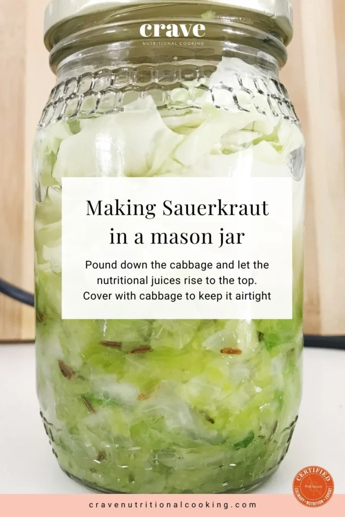 sauerkraut making or preparation, green cabbage in sealed glass jar pre-fermentation